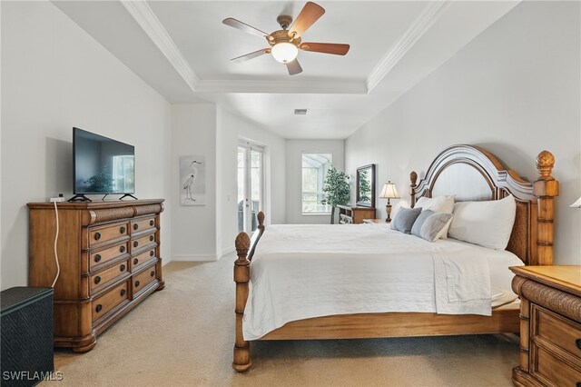 5408 SW 26th Ct, Cape Coral, FL 33914 - bedroom featuring light colored carpet, a raised ceiling, crown molding, and ceiling fan