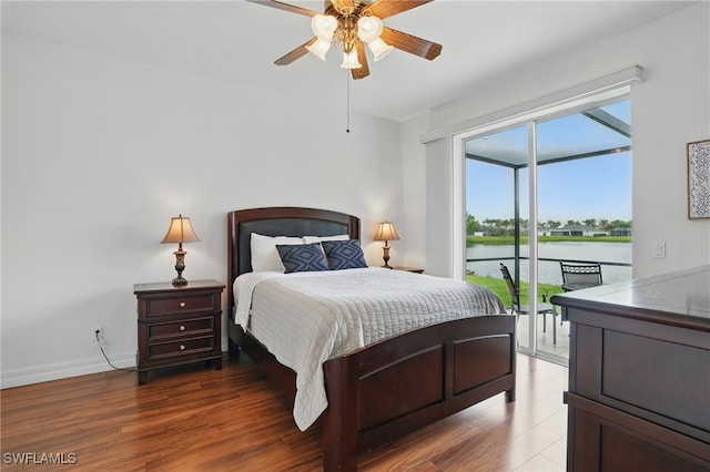 5408 SW 26th Ct, Cape Coral, FL 33914 - bedroom with access to exterior, a water view, wood finished floors, and a ceiling fan