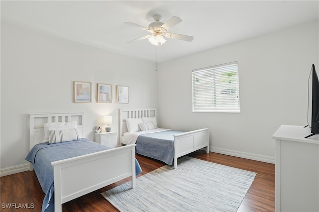 5408 SW 26th Ct, Cape Coral, FL 33914 - bedroom featuring dark wood finished floors and a ceiling fan