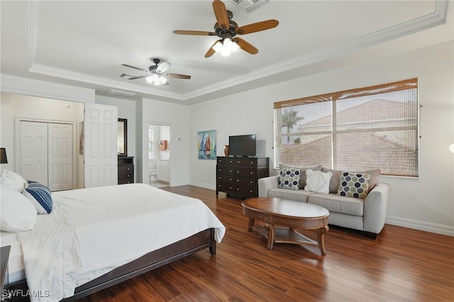 5408 SW 26th Ct, Cape Coral, FL 33914 - bedroom with a raised ceiling, wood finished floors, crown molding, a ceiling fan, and connected bathroom