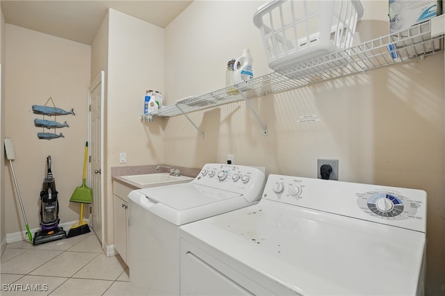 5408 SW 26th Ct, Cape Coral, FL 33914 - laundry room featuring washer and clothes dryer, light tile patterned floors, and cabinet space