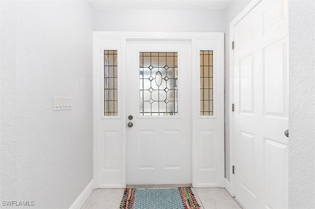 3825 Barnegat Dr, Punta Gorda, FL 33950 - doorway featuring baseboards and light tile patterned floors