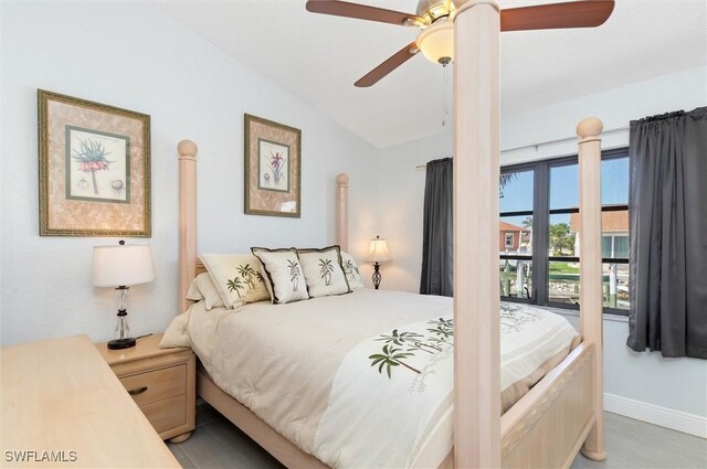 3825 Barnegat Dr, Punta Gorda, FL 33950 - bedroom with vaulted ceiling, ceiling fan, and baseboards