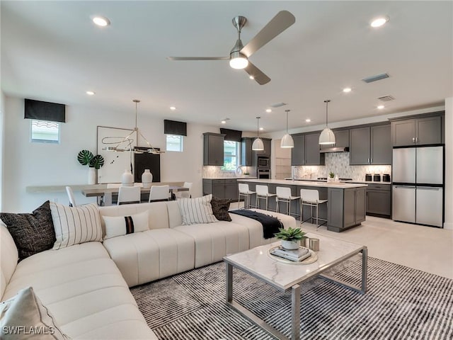17304 Green Buttonwood Way N, Fort Myers, FL 33917 - living room featuring ceiling fan, healthy amount of natural light, and recessed lighting
