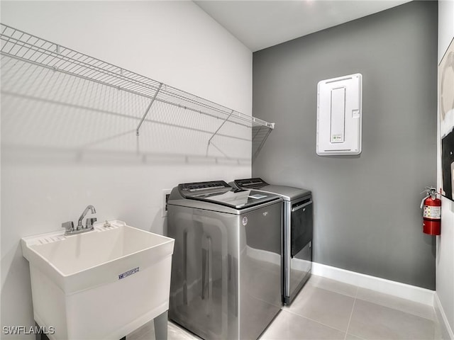 17304 Green Buttonwood Way N, Fort Myers, FL 33917 - laundry area featuring separate washer and dryer, baseboards, and light tile patterned flooring