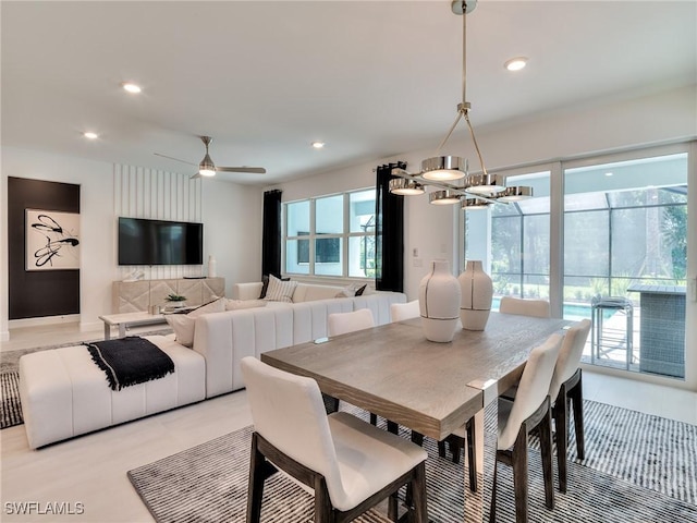17304 Green Buttonwood Way N, Fort Myers, FL 33917 - dining room featuring recessed lighting, a chandelier, and a ceiling fan