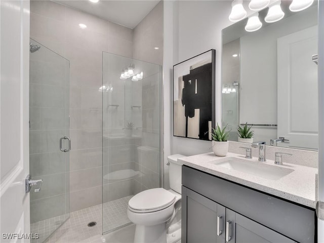 17304 Green Buttonwood Way N, Fort Myers, FL 33917 - bathroom featuring vanity, a shower stall, and toilet