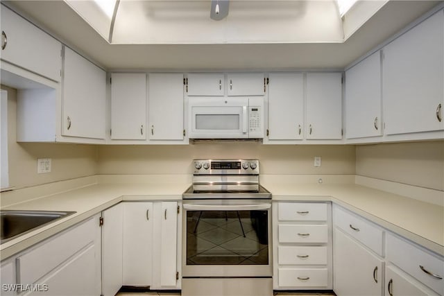 4013 SE 19th Pl Unit 101, Cape Coral, FL 33904 - kitchen featuring stainless steel electric range oven, white microwave, and white cabinets