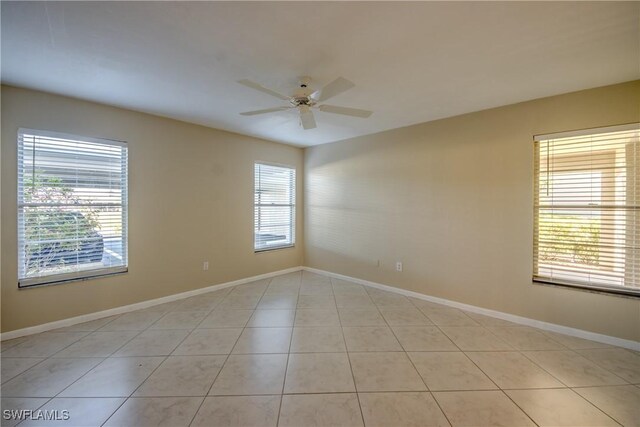 4013 SE 19th Pl Unit 101, Cape Coral, FL 33904 - empty room with a ceiling fan, baseboards, and light tile patterned floors
