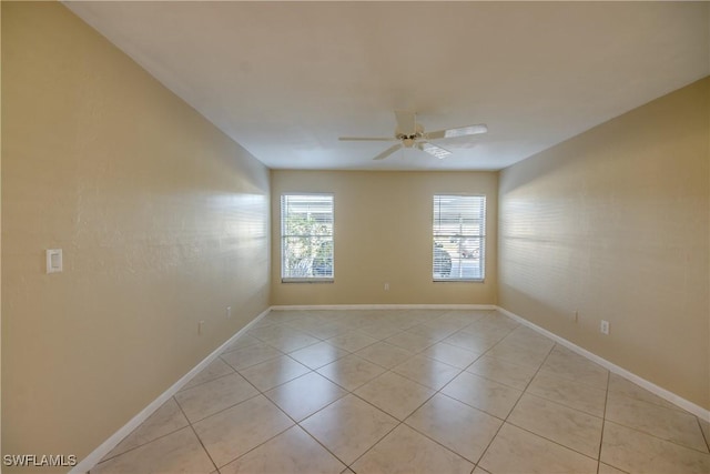 4013 SE 19th Pl Unit 101, Cape Coral, FL 33904 - spare room featuring ceiling fan, light tile patterned flooring, and baseboards