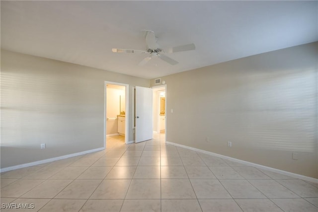 4013 SE 19th Pl Unit 101, Cape Coral, FL 33904 - empty room with baseboards, a ceiling fan, and light tile patterned flooring