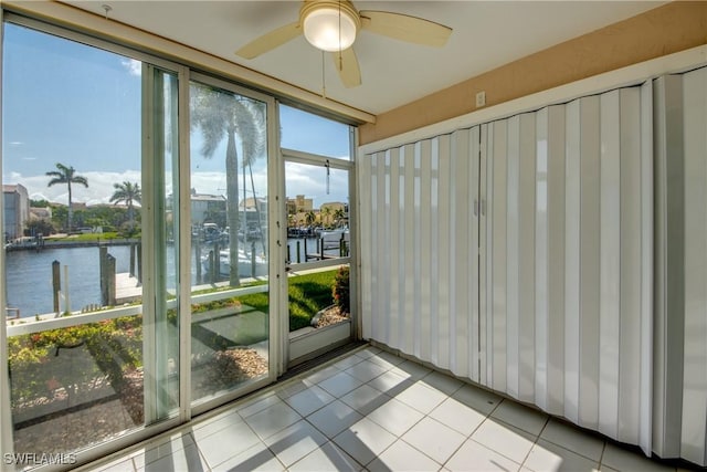 4013 SE 19th Pl Unit 101, Cape Coral, FL 33904 - unfurnished sunroom with a water view and ceiling fan