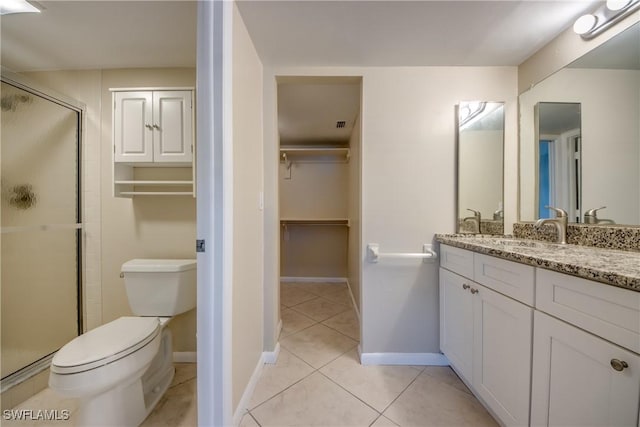 4013 SE 19th Pl Unit 101, Cape Coral, FL 33904 - full bath featuring vanity, a shower stall, a walk in closet, toilet, and tile patterned floors