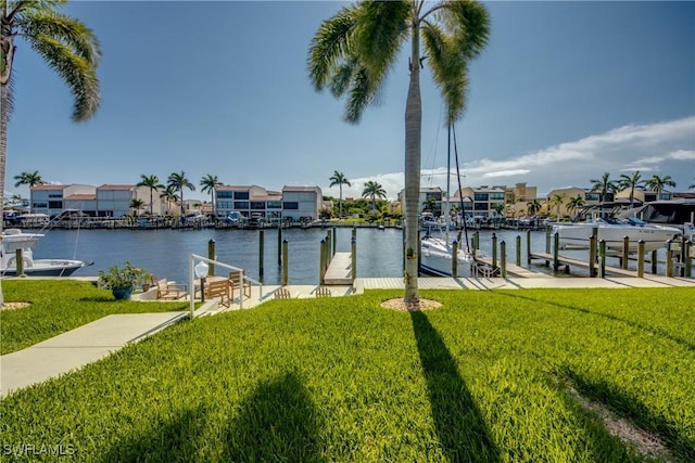 4013 SE 19th Pl Unit 101, Cape Coral, FL 33904 - dock featuring a lawn, a water view, and a residential view