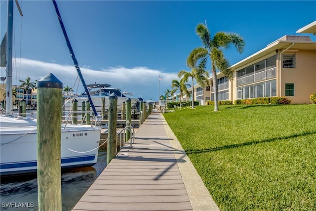 4013 SE 19th Pl Unit 101, Cape Coral, FL 33904 - dock area featuring a lawn