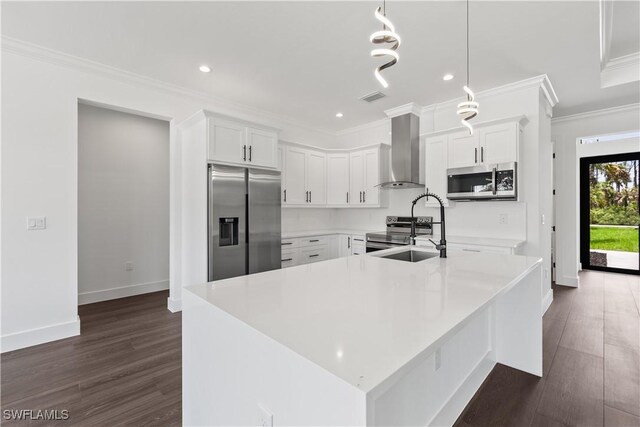 3473 14th Ave SE, Naples, FL 34117 - kitchen with stainless steel appliances, wall chimney range hood, dark wood-style floors, light countertops, and crown molding
