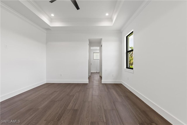 3473 14th Ave SE, Naples, FL 34117 - unfurnished room featuring a tray ceiling, dark wood-style floors, crown molding, recessed lighting, and ceiling fan