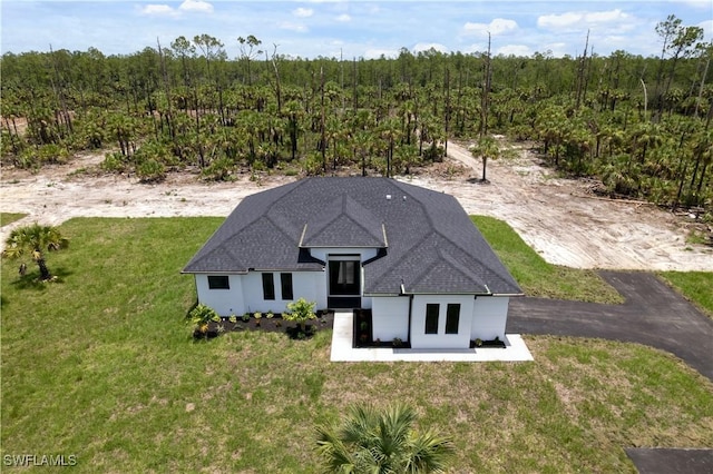3473 14th Ave SE, Naples, FL 34117 - aerial view of property and surrounding area with a heavily wooded area