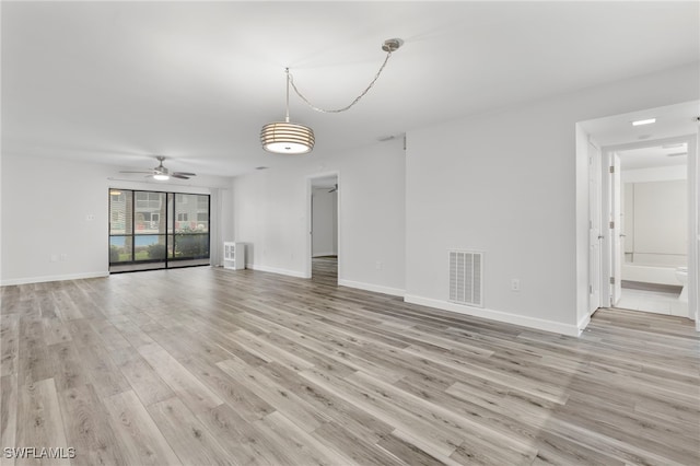4717 Santa Barbara Blvd Unit G-2, Cape Coral, FL 33914 - unfurnished living room with light wood finished floors, ceiling fan, and baseboards