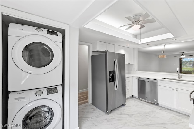 4717 Santa Barbara Blvd Unit G-2, Cape Coral, FL 33914 - kitchen featuring appliances with stainless steel finishes, estacked washer and dryer, ceiling fan, a sink, and light marble finish floors