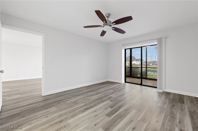 4717 Santa Barbara Blvd Unit G-2, Cape Coral, FL 33914 - spare room with wood finished floors, baseboards, and ceiling fan
