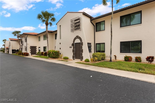 4717 Santa Barbara Blvd Unit G-2, Cape Coral, FL 33914 - view of front facade featuring stucco siding