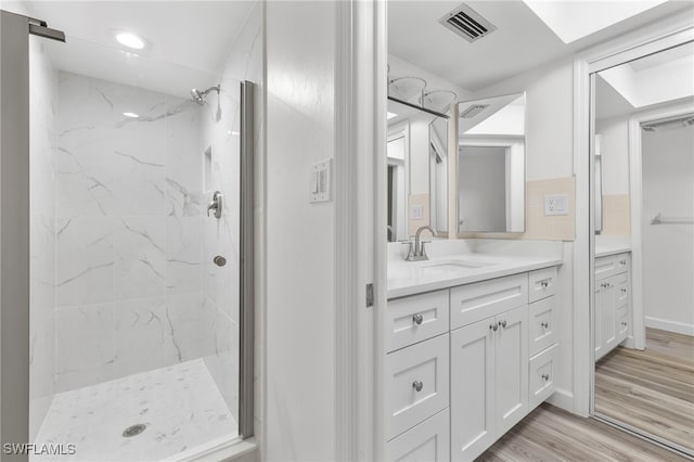 4717 Santa Barbara Blvd Unit G-2, Cape Coral, FL 33914 - full bath featuring vanity, a marble finish shower, and wood finished floors