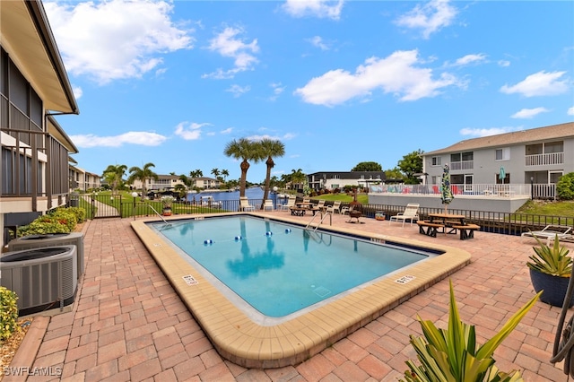 4717 Santa Barbara Blvd Unit G-2, Cape Coral, FL 33914 - community pool featuring cooling unit, a patio area, and a residential view