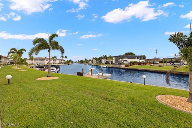 4717 Santa Barbara Blvd Unit G-2, Cape Coral, FL 33914 - dock with a lawn, a water view, and a residential view