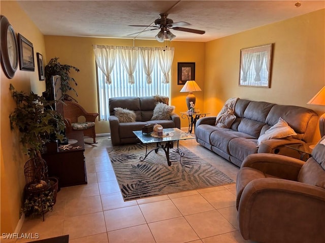 2526 SE 16th Pl Unit 105, Cape Coral, FL 33904 - tiled living room featuring a ceiling fan and a textured ceiling