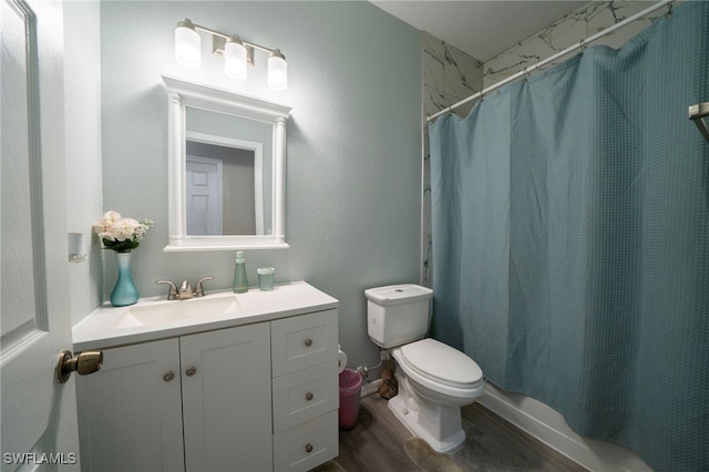 2759 Orange Grove Trl, Naples, FL 34120 - bathroom with wood finished floors, vanity, toilet, and a shower with curtain