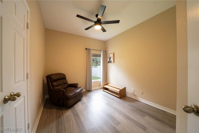 2759 Orange Grove Trl, Naples, FL 34120 - sitting room with wood finished floors, ceiling fan, and baseboards