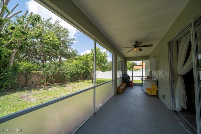 2759 Orange Grove Trl, Naples, FL 34120 - unfurnished sunroom featuring ceiling fan