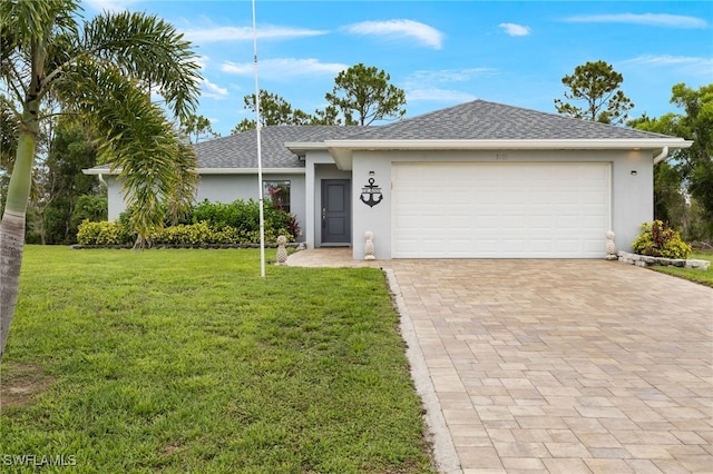 3901 NW 48th Ter, Cape Coral, FL 33993 - ranch-style house featuring stucco siding, a front lawn, decorative driveway, and a garage