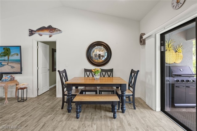 3901 NW 48th Ter, Cape Coral, FL 33993 - dining space featuring light wood finished floors, baseboards, and vaulted ceiling