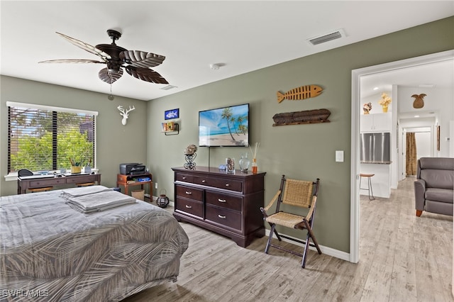 3901 NW 48th Ter, Cape Coral, FL 33993 - bedroom featuring light wood-type flooring, a ceiling fan, and baseboards