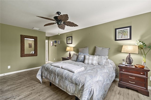 3901 NW 48th Ter, Cape Coral, FL 33993 - bedroom with baseboards, wood finished floors, and a ceiling fan