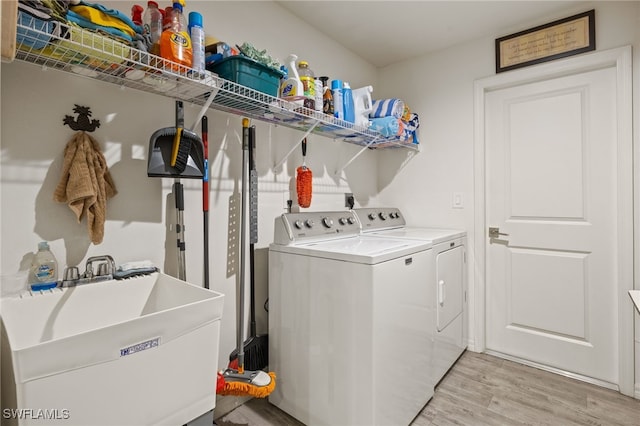 3901 NW 48th Ter, Cape Coral, FL 33993 - washroom with washer and dryer and light wood-style floors