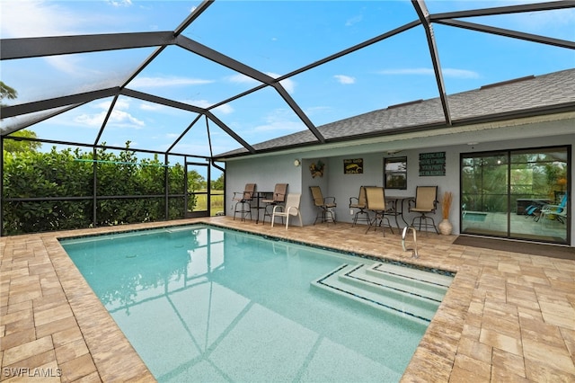 3901 NW 48th Ter, Cape Coral, FL 33993 - outdoor pool featuring a patio area and glass enclosure
