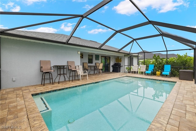 3901 NW 48th Ter, Cape Coral, FL 33993 - outdoor pool featuring area for grilling, a patio area, and a lanai