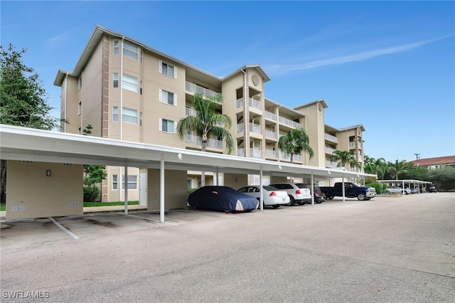 4040 Durango Ct Unit 101, Estero, FL 33928 - view of apartment building / complex with covered parking