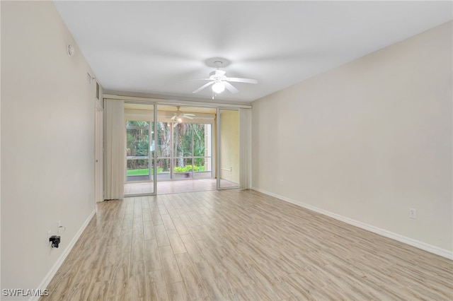 4040 Durango Ct Unit 101, Estero, FL 33928 - unfurnished room with ceiling fan, baseboards, and wood finished floors