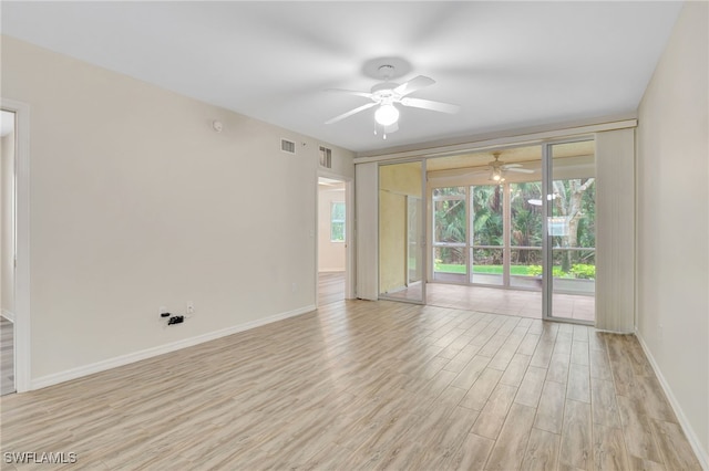 4040 Durango Ct Unit 101, Estero, FL 33928 - spare room with a ceiling fan, light wood-style floors, and baseboards