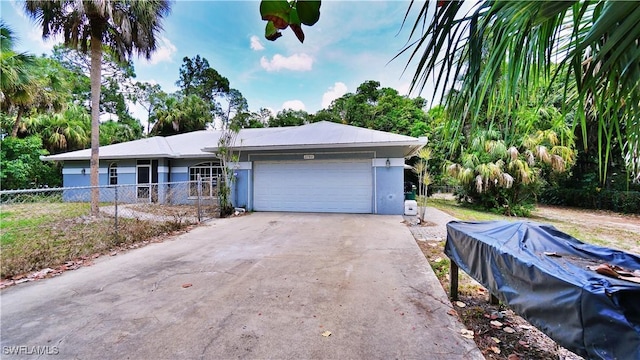2780 39th St SW, Naples, FL 34117 - ranch-style home featuring an attached garage, concrete driveway, and stucco siding
