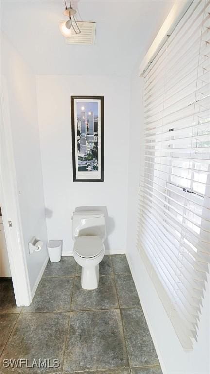 2780 39th St SW, Naples, FL 34117 - bathroom featuring toilet and baseboards