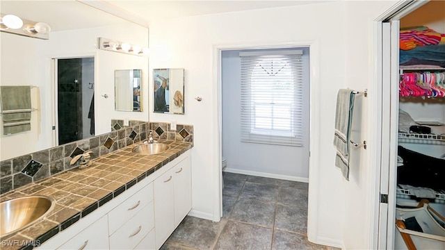 2780 39th St SW, Naples, FL 34117 - full bathroom with double vanity, a spacious closet, and a shower