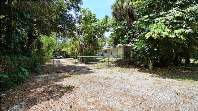 2780 39th St SW, Naples, FL 34117 - view of yard featuring a gate