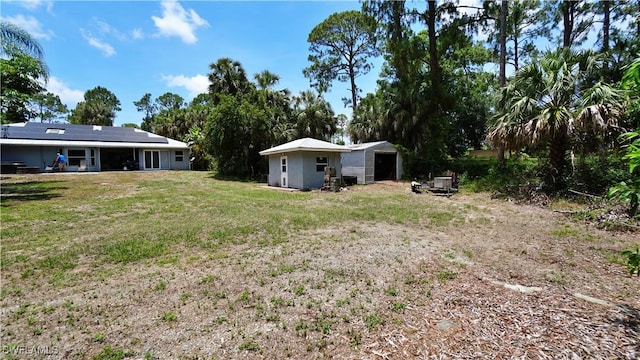 2780 39th St SW, Naples, FL 34117 - view of grassy yard featuring an outbuilding