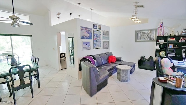 2780 39th St SW, Naples, FL 34117 - living room with a ceiling fan, light tile patterned floors, and high vaulted ceiling