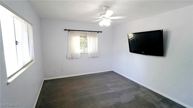 2780 39th St SW, Naples, FL 34117 - unfurnished room with a ceiling fan and dark carpet